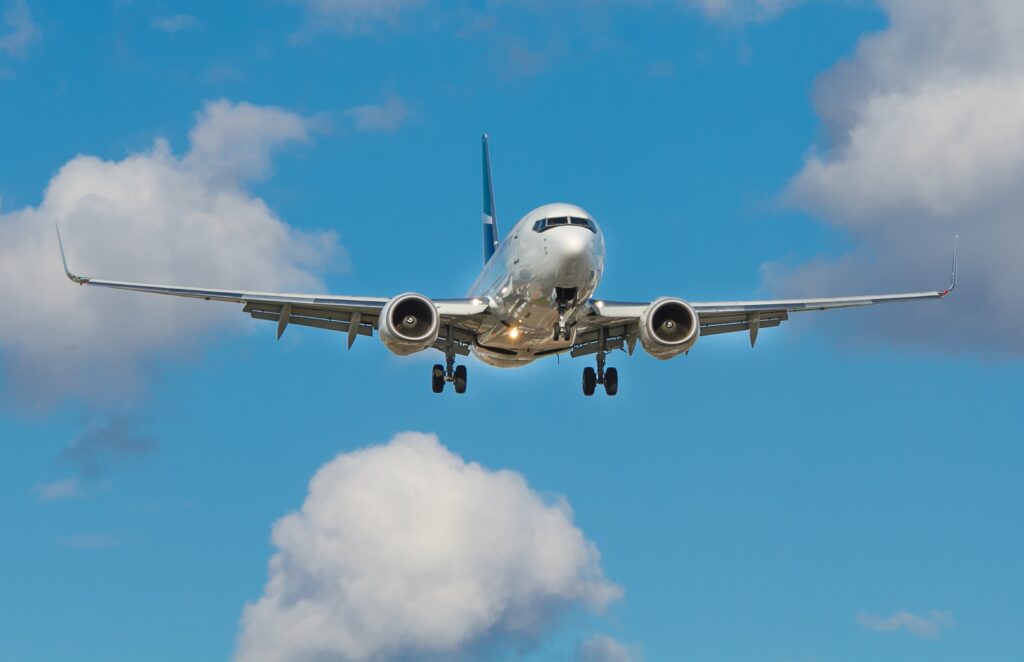 Airplane in the sky with clouds